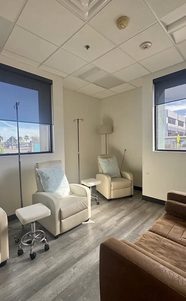 PISO Medical’s IV lounge: cream recliners beside a tall window overlooking the Banner Desert campus